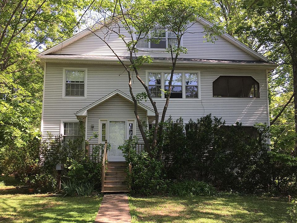 Historic 1910's home surrounded by trees and spacious yard