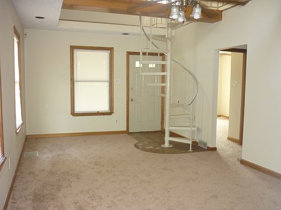 living area with loft above