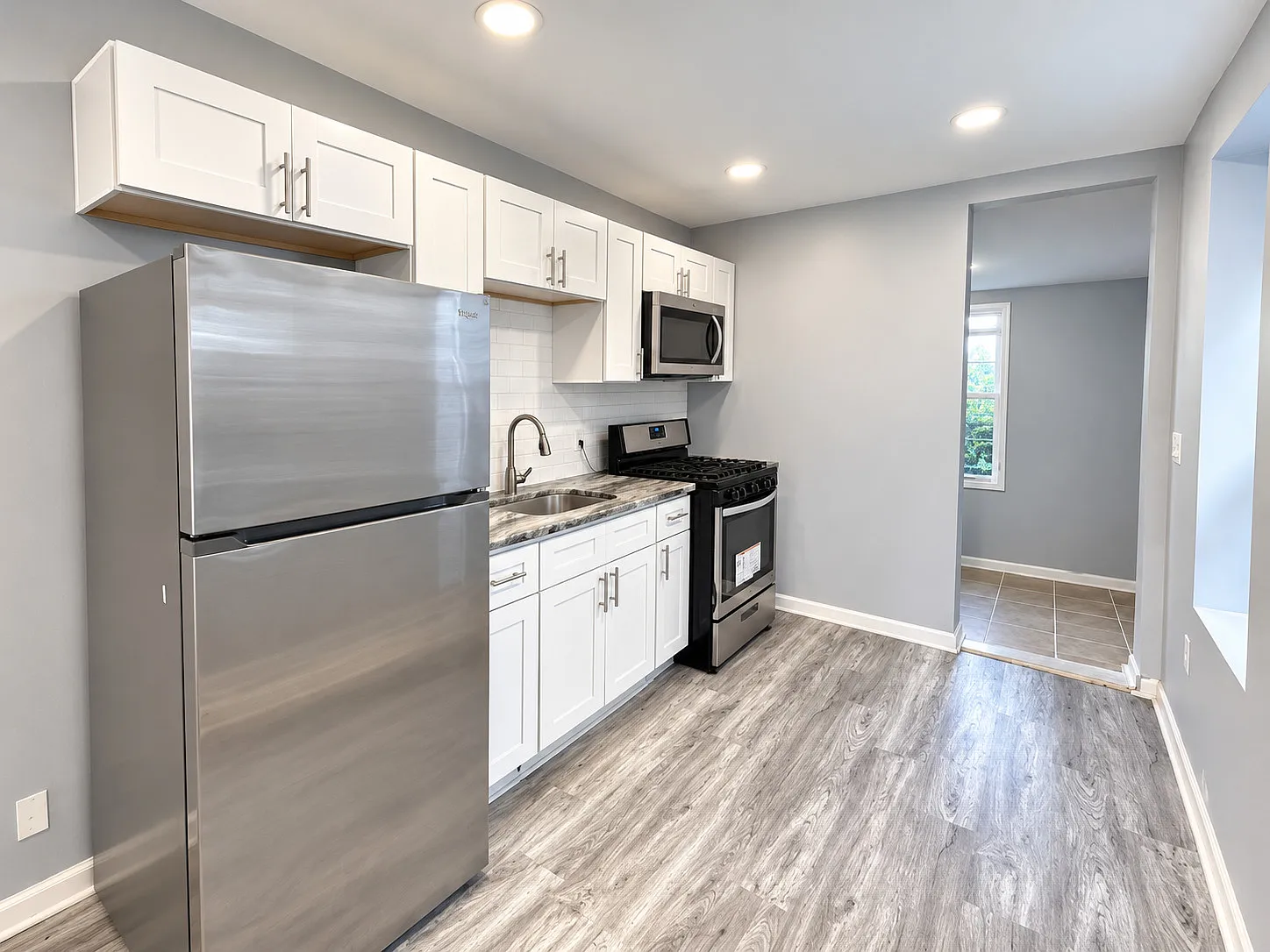 Light-Filled 3-Bedroom Home with Central Air & a Stylish Kitchen — Photo 4