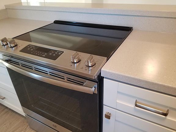 New stainless steel oven. Corian counter tops.