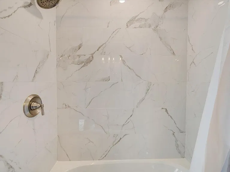 Main bathroom with shower/tub. Brand new