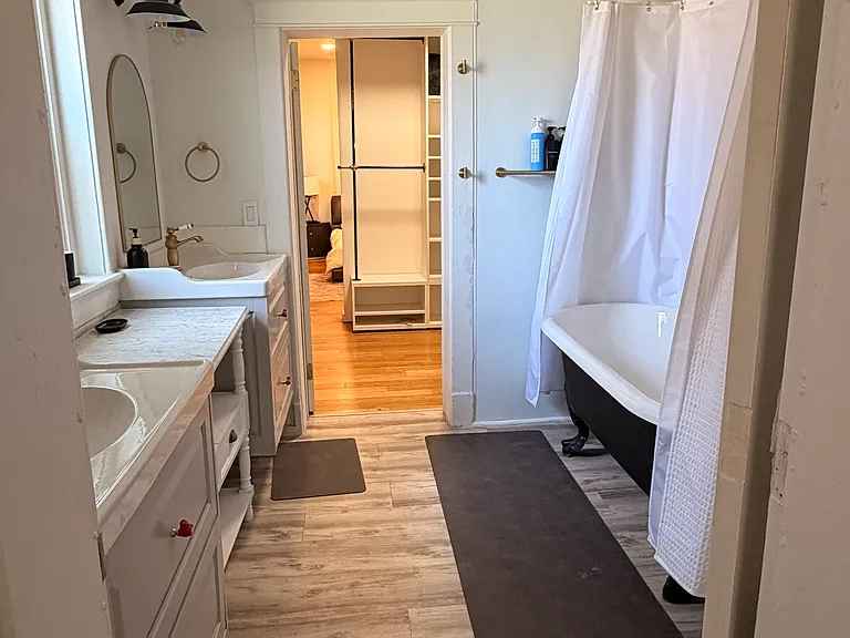 walk thru from primary closet to back area with W/D