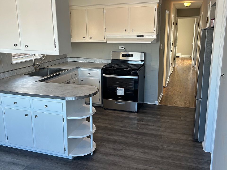 Kitchen, brand new stainless appliances. No dishwasher.