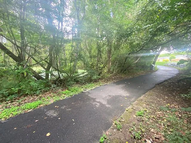 1.5 mile, paved walking trail steps away from outdoor patio fence.