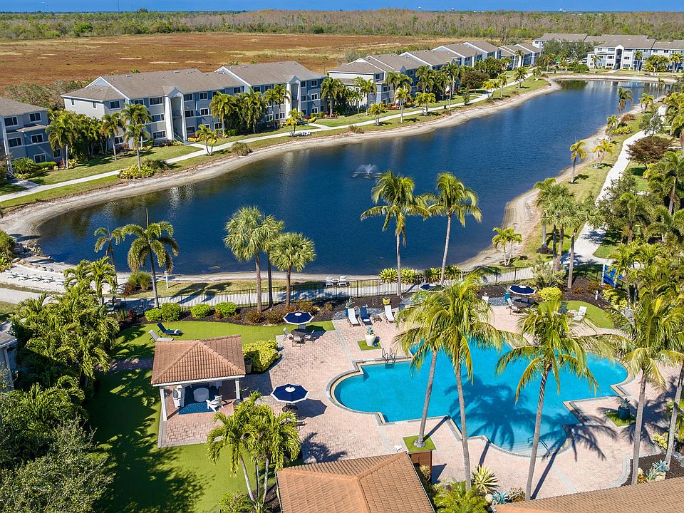 Enjoy a stunning aerial view of our community, offering resort-style amenities, picturesque waterfront views, and a tranquil atmosphere.