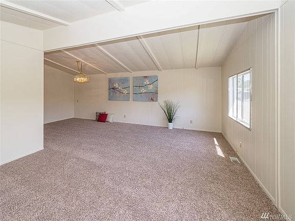 Welcome in!  Large living room and dining room with vaulted ceiling, fresh carpet and paint! 