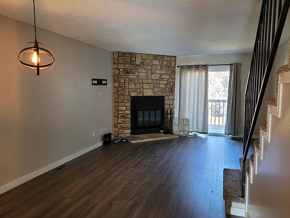 Dining room and living room. Stairs to the right to go upstairs. Access to a large balcony.