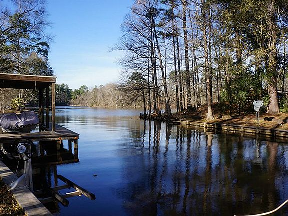 Water depth is 3 ft behind lots.  Neighbor has boat in lift.
