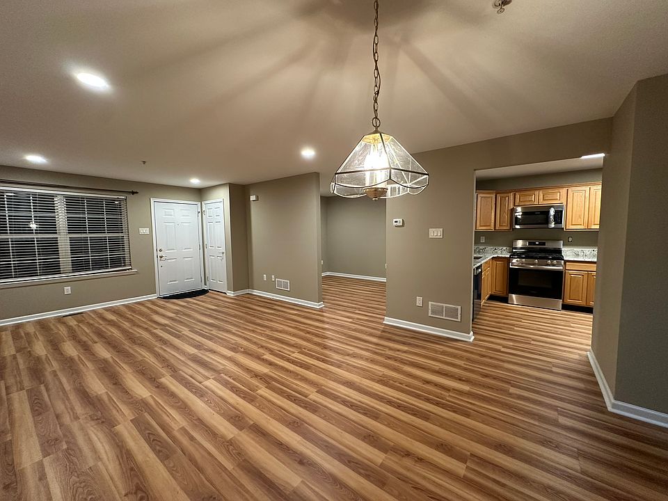First floor with a large family room, living area, patio and kitchen