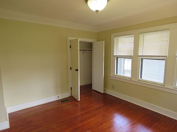 Bedroom is large, airy, and has ample closet space.
