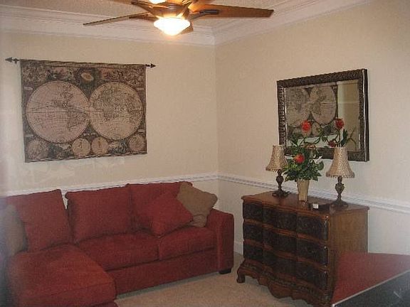 Lovely den with crown molding & chair rail