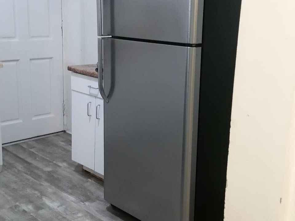 New floors in the kitchen and new refrigeartor