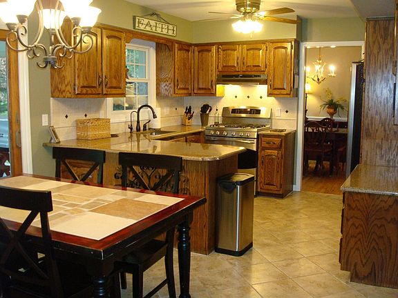 Updated Eat-In Kitchen w/granite counters & ceramic tile floor.