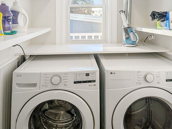 Kitchen and pantry with in-unit washer and gas dryer