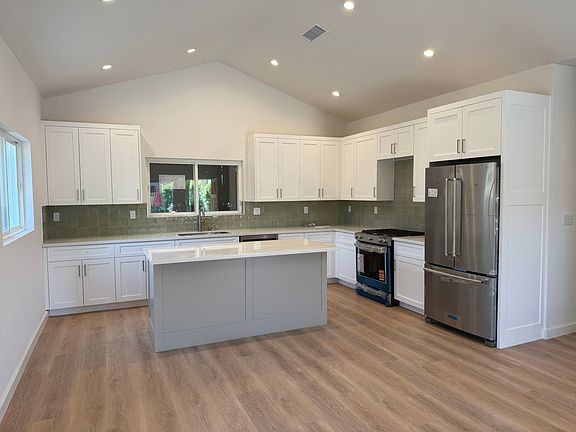 Custom wood cabinets with brand new premium Kitchen-aid appliances.