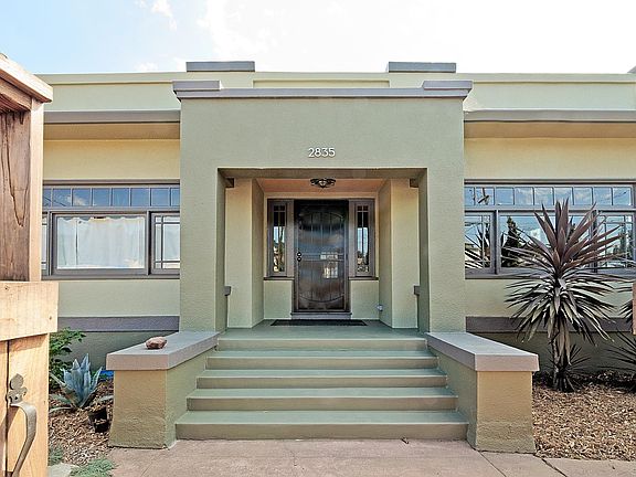 Large entry & inviting stoop. East Exposure. Front bedroom (left) gets morning sun.
