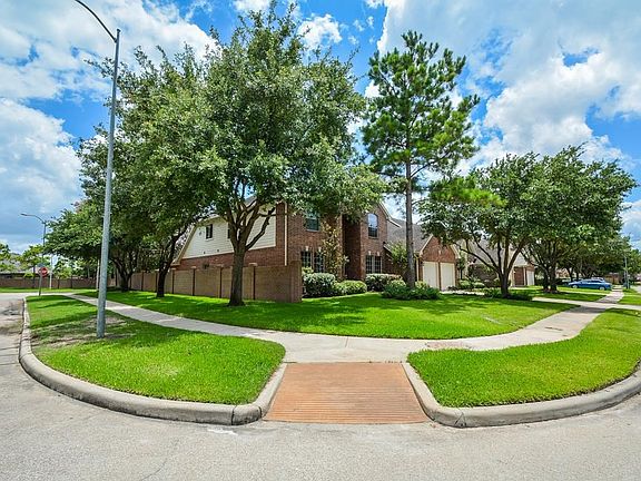 Excellent curb appeal with mature landscaping.