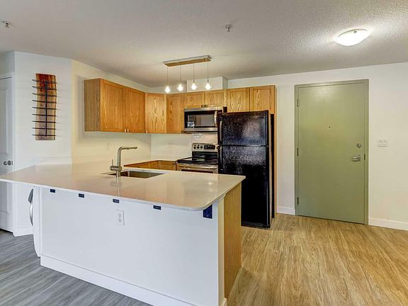 5th image of 102-186 Kananaskis Way #102