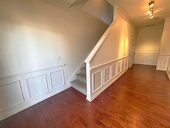First floor hallway with spacious coat closet.