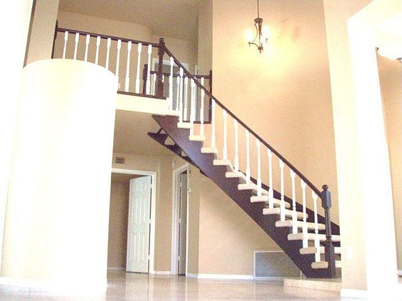 Gorgeous Stair Case Leads up to 3 More Large Bedrooms