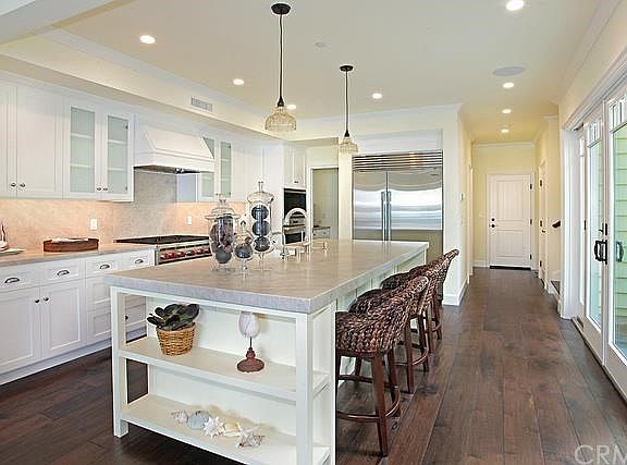 Chef's kitchen with granite counters and stainless steel appliances