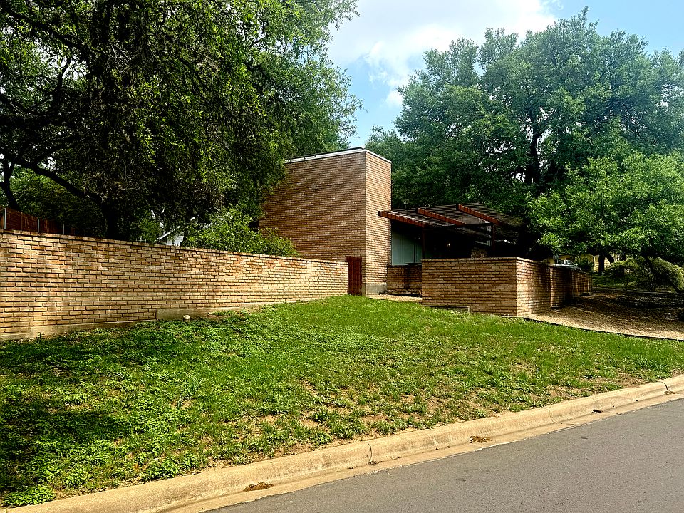 Side front lawn that blooms with bluebonnets and native wildflowers each spring