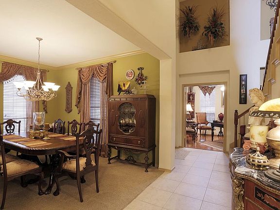 Rich & Vibrant Dinning Room Flowing into a Warm Home.