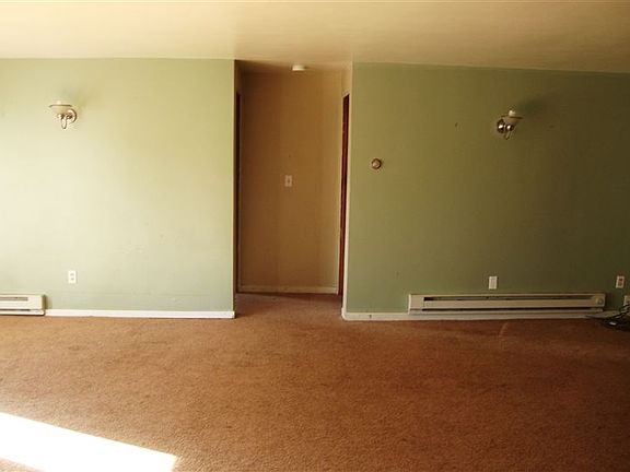 Living Room, Wall are newly painted white. Not colored like