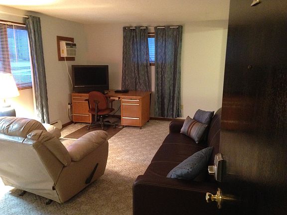 Leather recliner, large desk, berber carpet, storage entry,