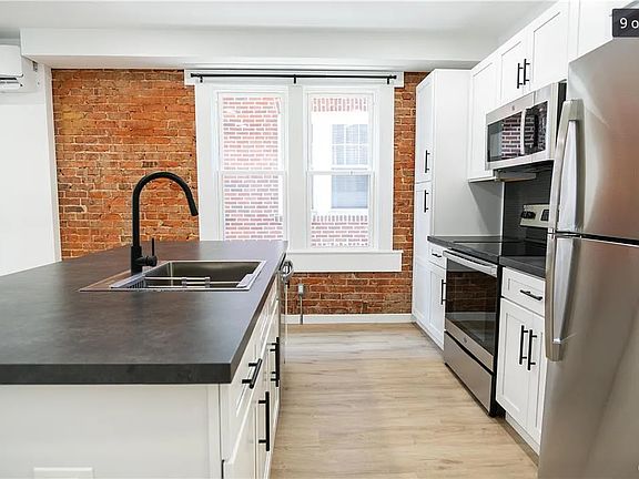 Kitchen with microwave, stove, refrigerator and dishwasher included