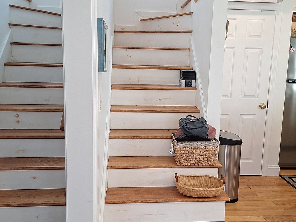 Two units joined into one, 1 bedrooom, 1 bathroom at the top of each staircase, separated by the conjoining wall. Downstairs open living room/dining room kitchen.