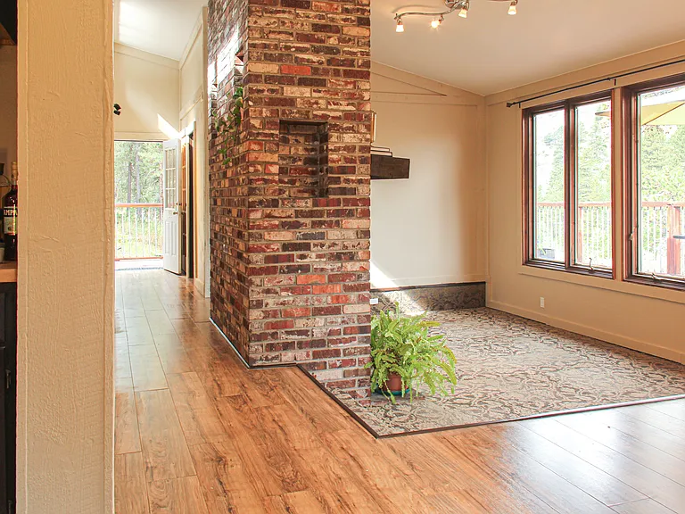 The bright and warm living room with 7 ft. windows.