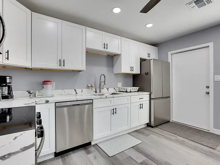 spacious kitchen with stainless steel appliances (including dishwasher)