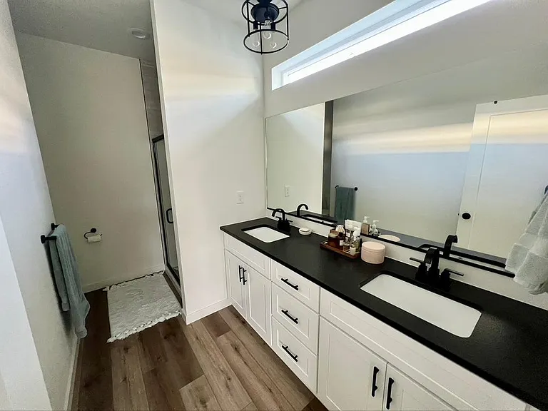 Large master bath with dual vanity and shower.