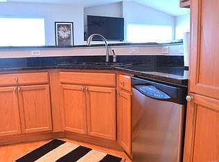 Granite and custom lighting in kitchen.