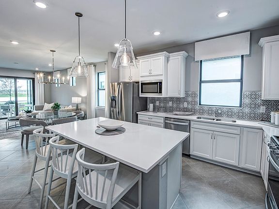 Kitchen with large center island and stainless steel appliances