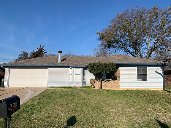 Large front yard and 2 car garage.