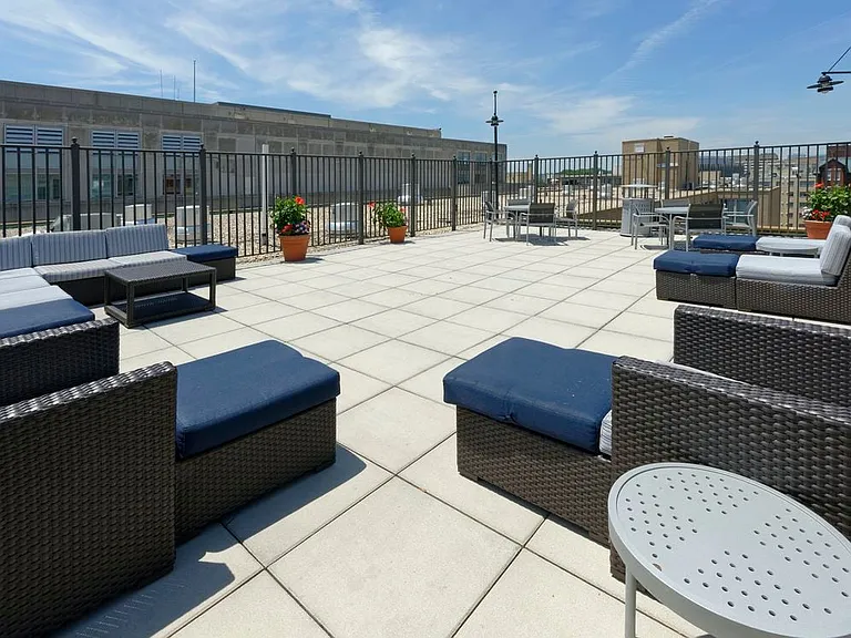 Rooftop lounge chairs and seating area, facing towards E and 21st Streets