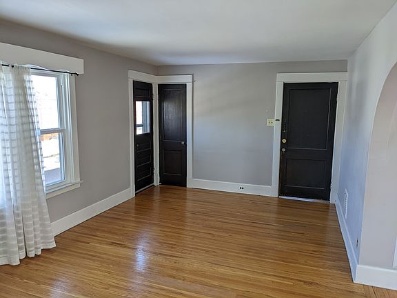 Living Room (Door on right is entrance to apartment. Door on left is a closet.)