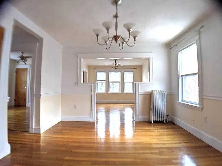 Living Room to Dining Room and Front Bedroom (left)