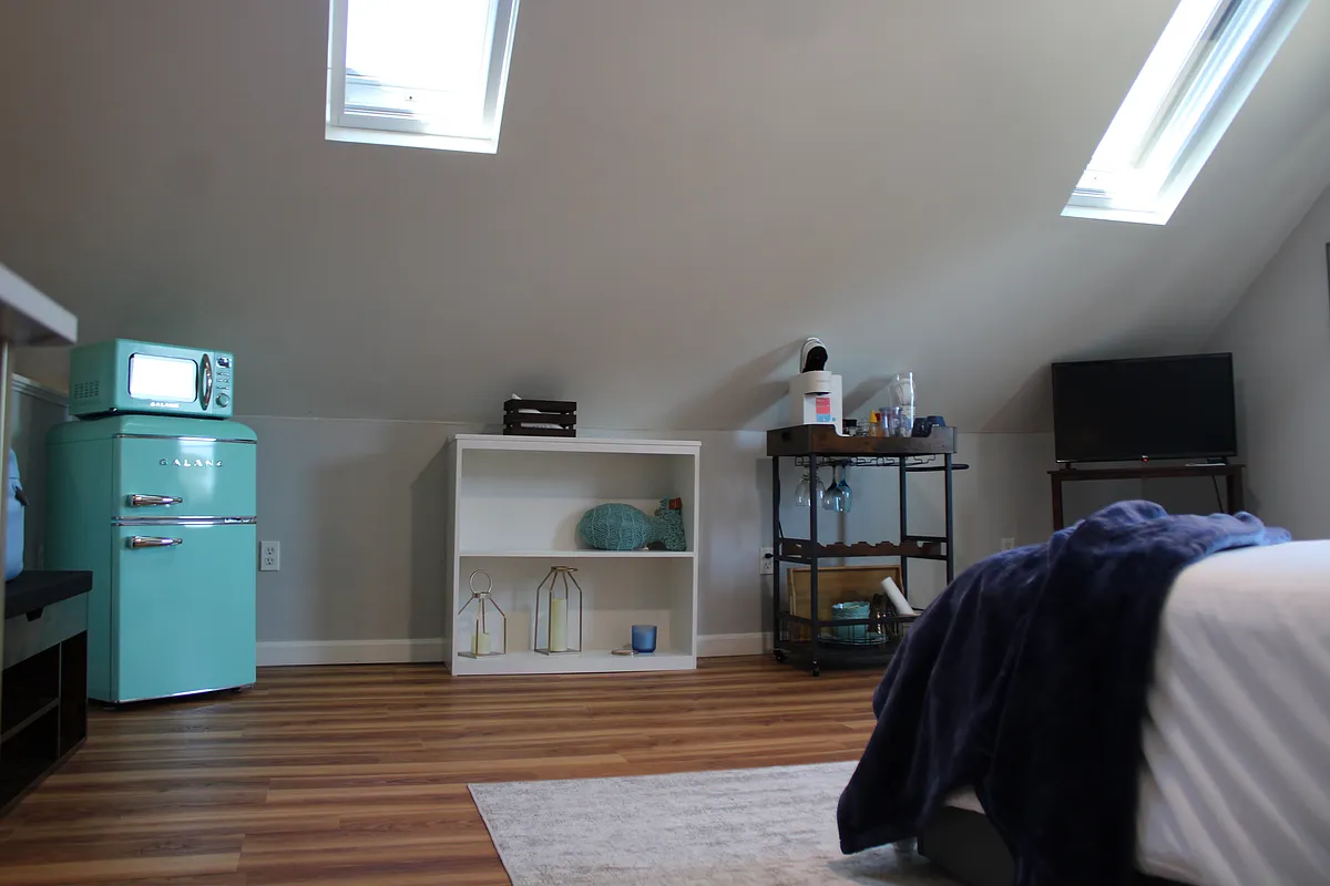 3rd Floor master bedroom, features its own fridge, microwave, coffee maker and TV - King St