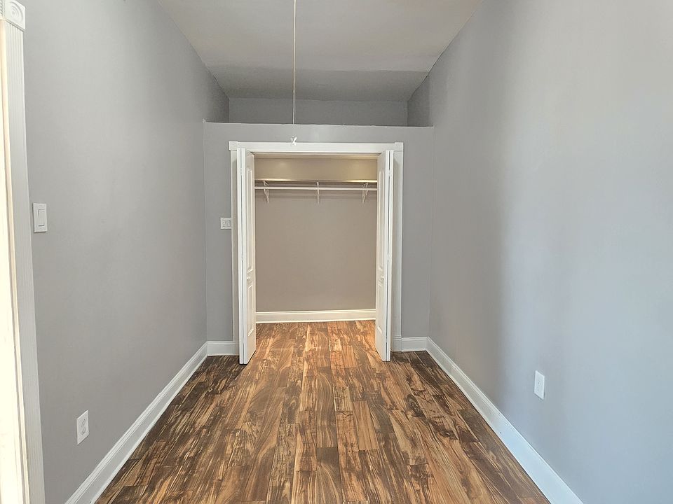 Bedroom 1 with large storage space above closet