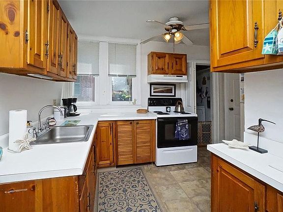 Kitchen with attached laundry room.