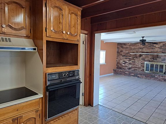 view of living room with fireplace from the kitchen