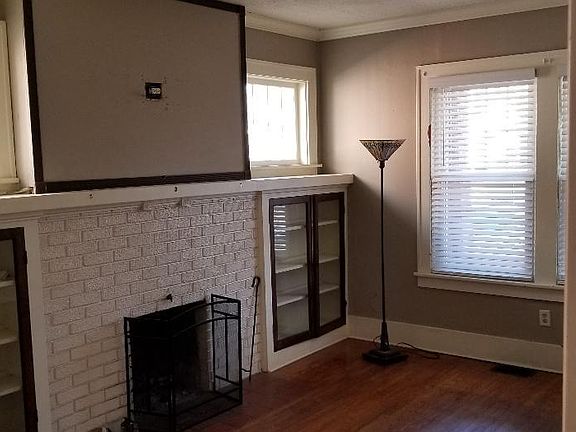 Living room with built-ins and fireplace