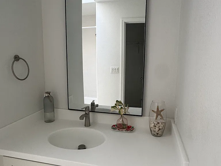 Master bedroom bathroom. Newly renovated bathroom vanity, countertop, & hardware.