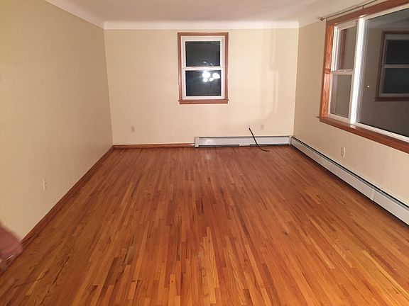 Spacious living room with hardwood floors