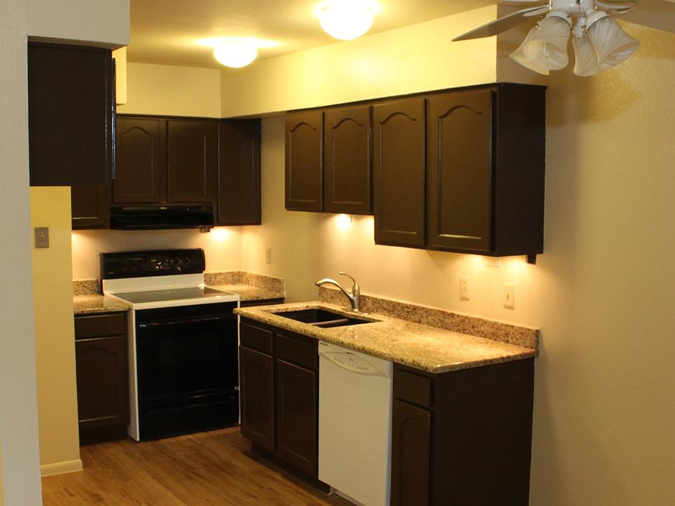 Kitchen features custom cabinets, granite counters, dishwasher, and under cabinet lighting!
