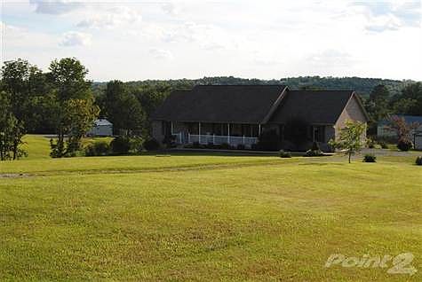Very large front yard with nice porch for relaxing and enjoying the scenery!