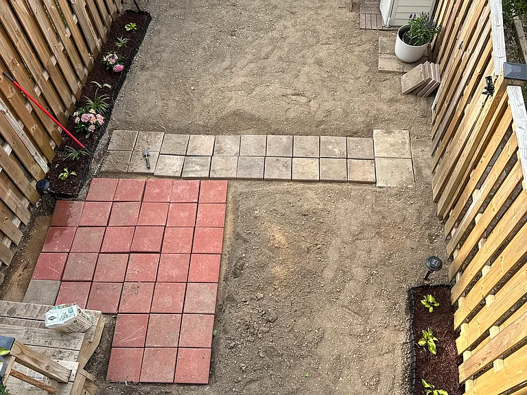 Fully fenced private back yard with paver'ed area for grill. Shed with gardening tools provided.